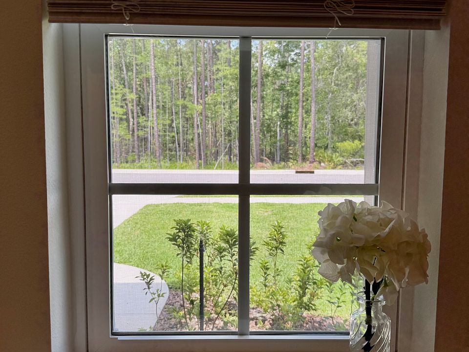 See the protected wooded preserve across the street.