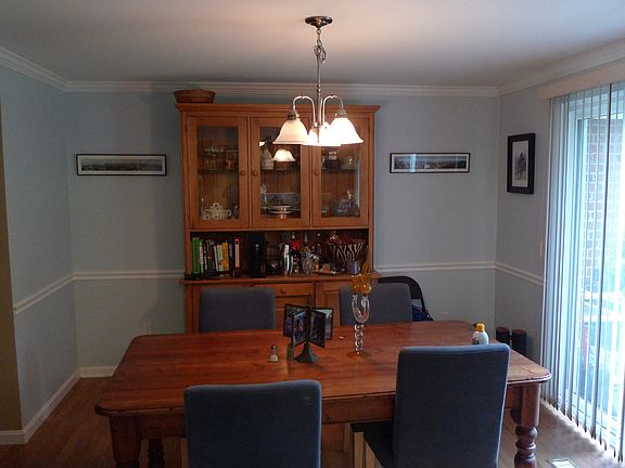 dining room with sliding glass door to small fenced back yar