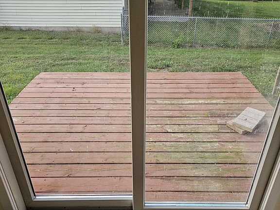 Patio doors off the kitchen with deck