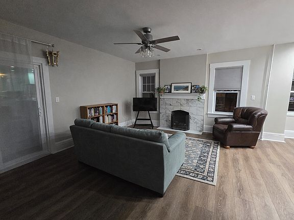 Large living room open to kitchen/dining. Fireplace with gas log and remote.