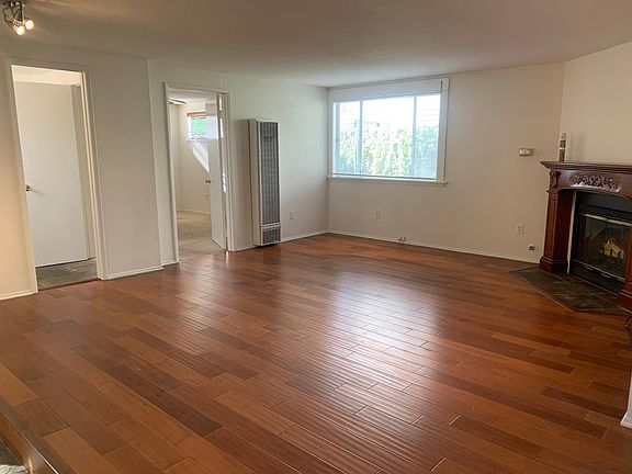 Living room with wood burning gas fireplace