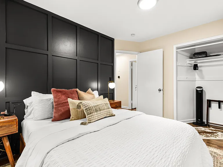 A cozy bedroom with a touch of modern style.
