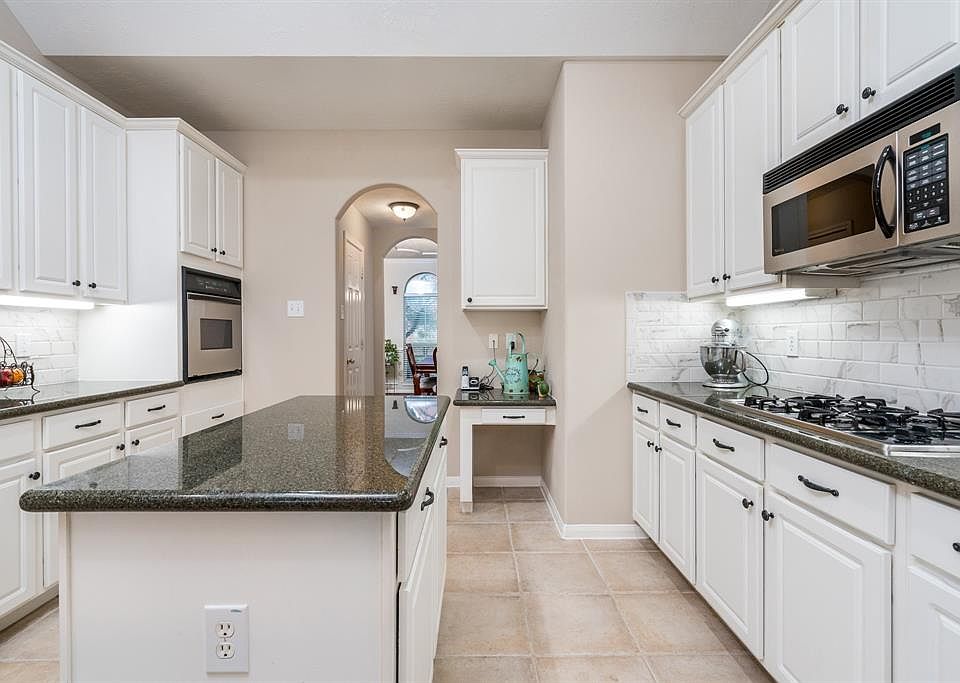 Welcome to this beautiful home zoned to desirable Klein ISD. The home has many updates throughout including this granite island kitchen.