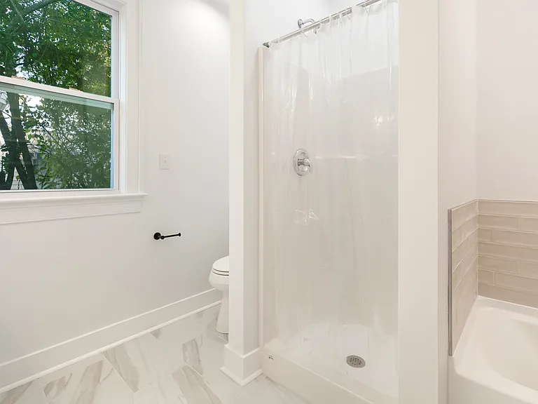 New master bathroom with walk-in closet.