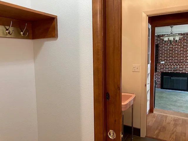 Coat closet near the front door. Half bath and "Brick Room" beyond.