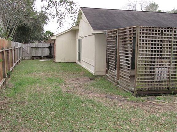 Backyard with a covered deck for entertaining