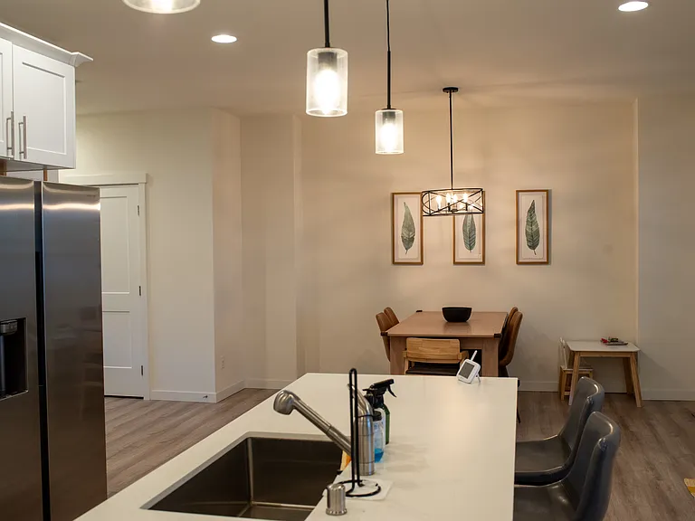 Kitchen & dining room. Large windows on the right