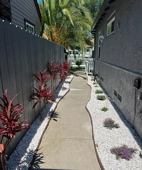 gated entrance with all new landscape
