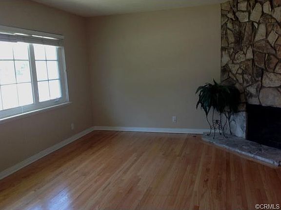The freshly refinished hardwood floors enhance the living room.