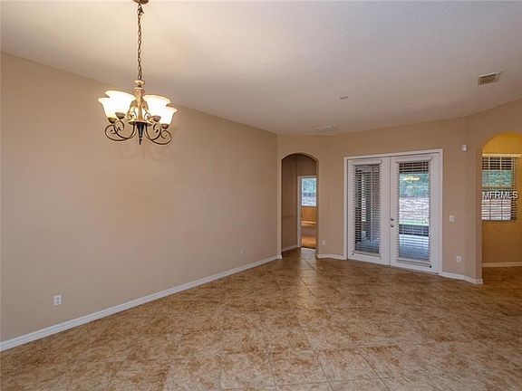 Dining Room. Living Room. French Doors to Covered Screened Porch