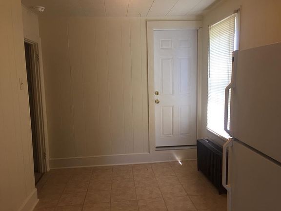 Dining Area View from kitchen. Door to attic storage