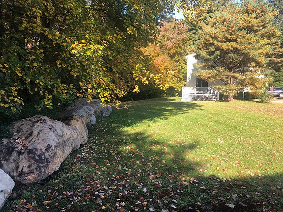View of large side/back yard from fence line