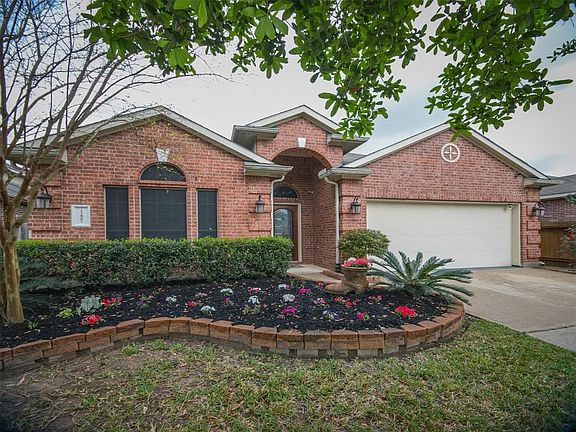 Recently landscaped with new mulch and flowers.