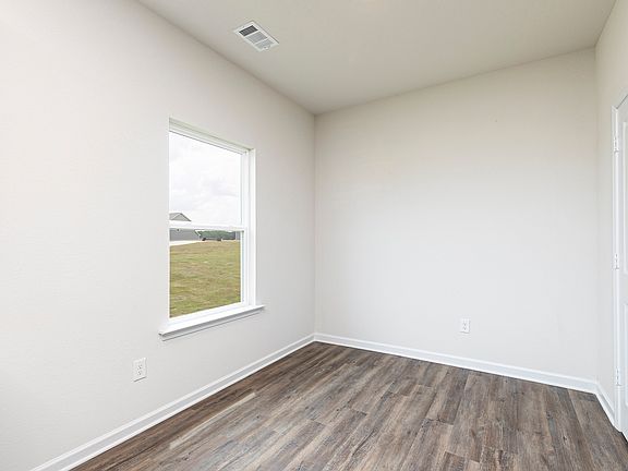 Nestled next to the kitchen is a quaint breakfast area