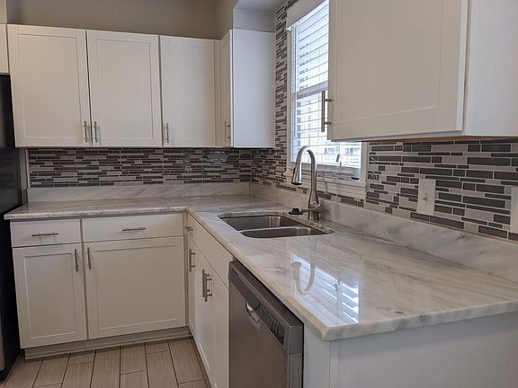 Luxurious kitchen with a beautiful backsplash.