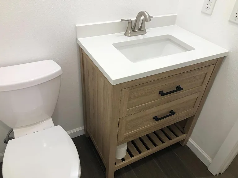 Bathroom sink/vanity and toilet
