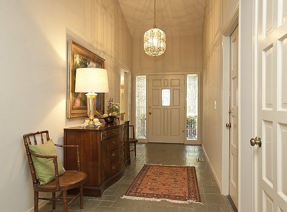 Entry withtall ceiling and ceramic tile.