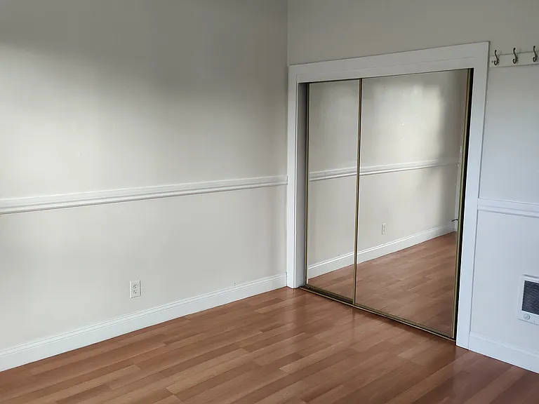 standing near back bedroom window