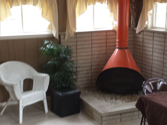 Sunroom with fireplace