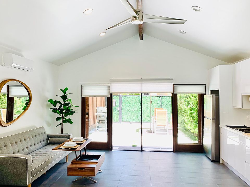 French Doors open up into the yard. Pulldown Blinds, Magnetic Screen to keep the bugs out. Ceiling fan, Dimming lights. Ac/Heat.
