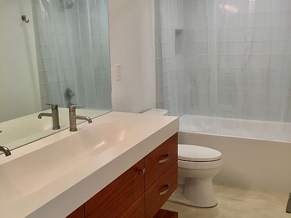 Downstairs bathroom with shower and jetted tub
