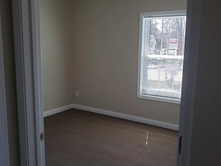 Bedroom with Ceiling Fan/Light. Quality carpet. Mini Blind window treatment.