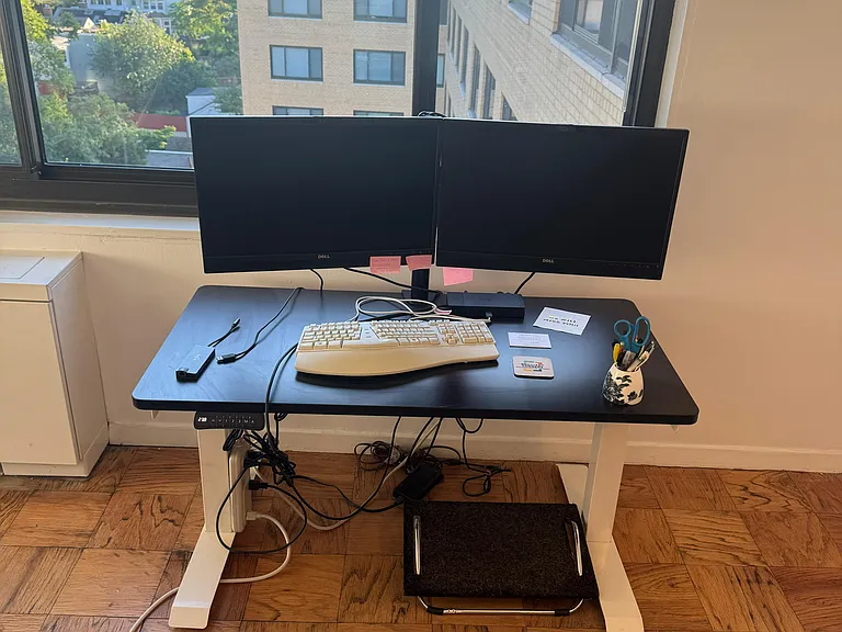 Adjustable Flexispot desk at its lowest height setting.