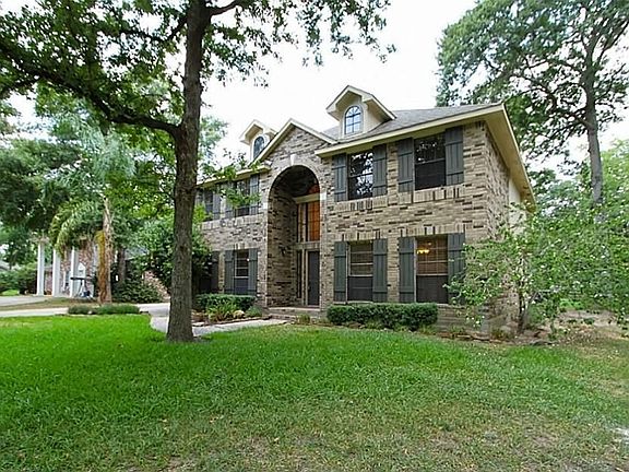 This home sits on a large lot with mature trees.