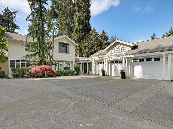 The Manor is stunning from all angles, here's a view of the rear with breezeway which connects oversized 3-car garage.