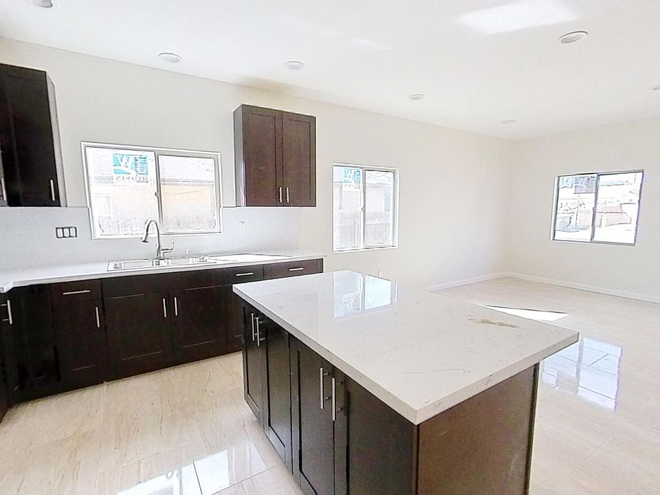 Spacious kitchen with ample dining area.