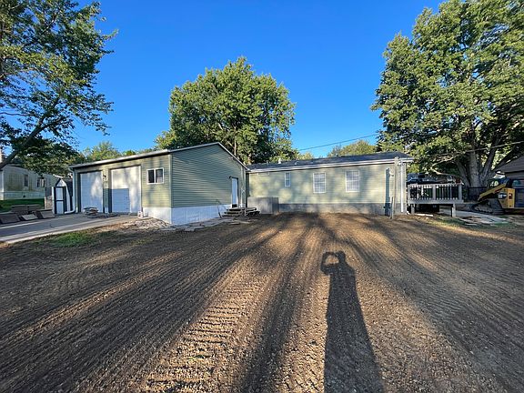 Huge 2 car garage. Back of the home with option to take gravel road to the home.