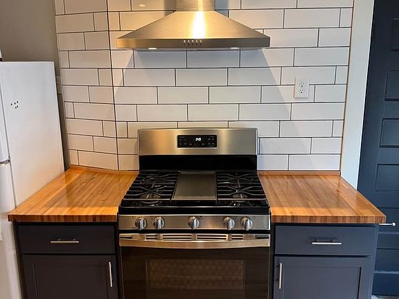 Updated kitchen tile and stainless steel appliances