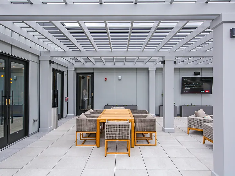 Rooftop deck with TV and chairs