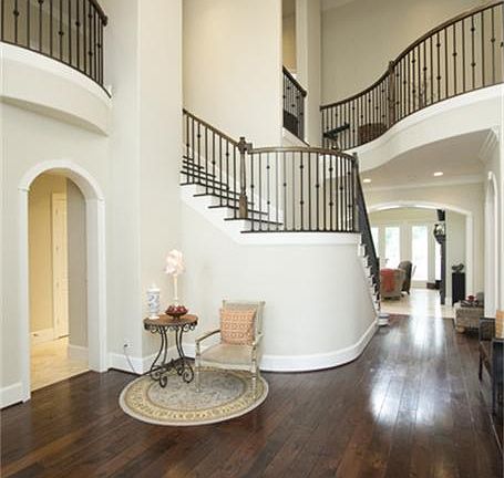 Dramatic two story entry with inviting wide plank hardwood floors.