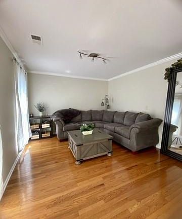 Second living room or a potential 5th bedroom on main floor.