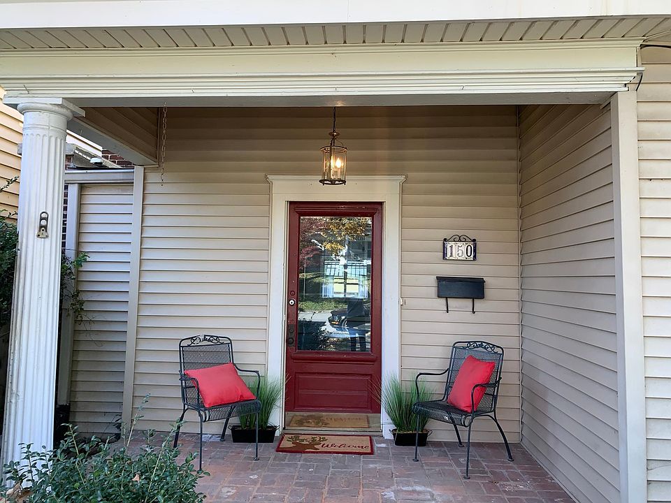 covered front porch of 2 story house at the end of the street in a quiet neighborhood full of things to do