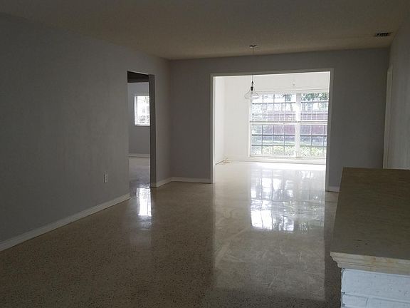 View from entry of living room, dining area and family room.