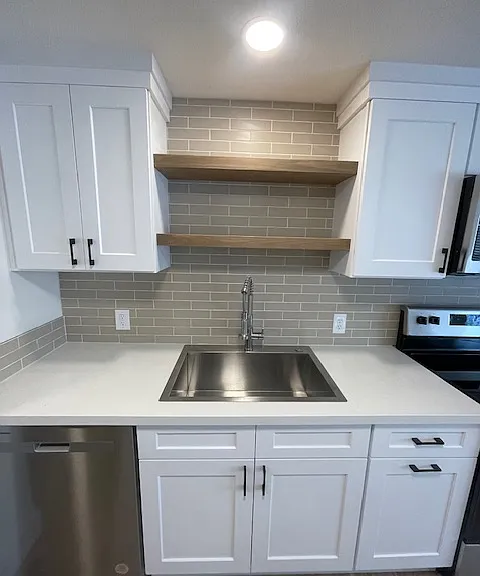 Excellent work space in a large gourmet kitchen with stainless steel tall tub dishwasher