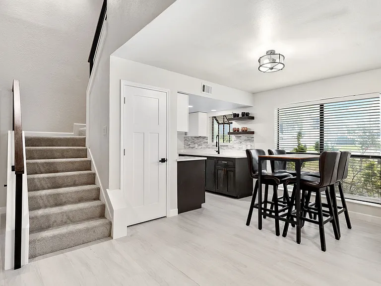 Dining room featuring sink and light hardwood / wood-style flooring