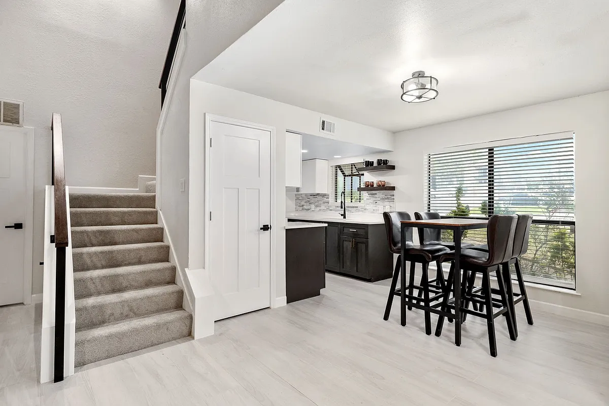 Dining room featuring sink and light hardwood / wood-style flooring - 2101 Park Willow Ln #C