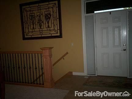 This is the front door, to the left are the basement steps. .