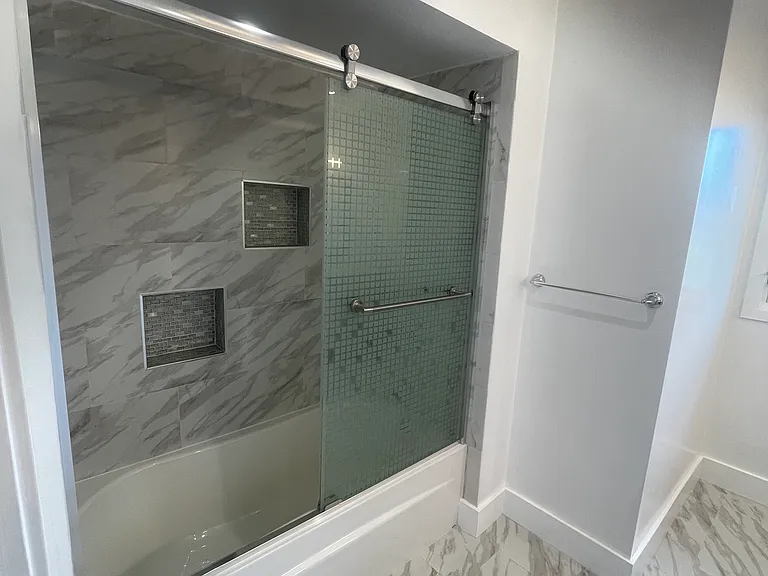 Stall shower in the shared bathroom