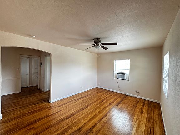 Where Historic Charm Meets Modern Comfort. Enjoy relaxing in this bright, warm, newly painted living room.
