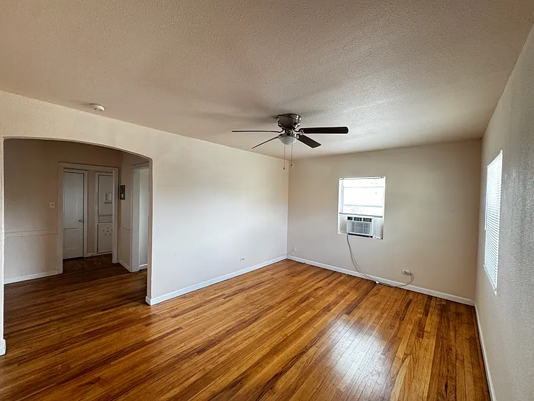 Where Historic Charm Meets Modern Comfort. Enjoy relaxing in this bright, warm, newly painted living room.