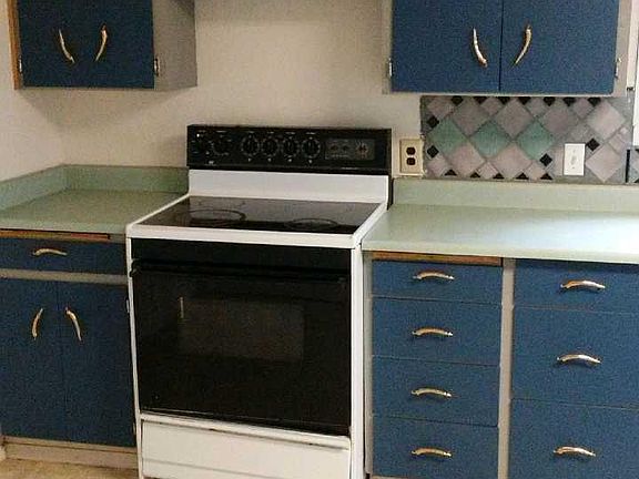 Brass Chili pepper handles in kitchen