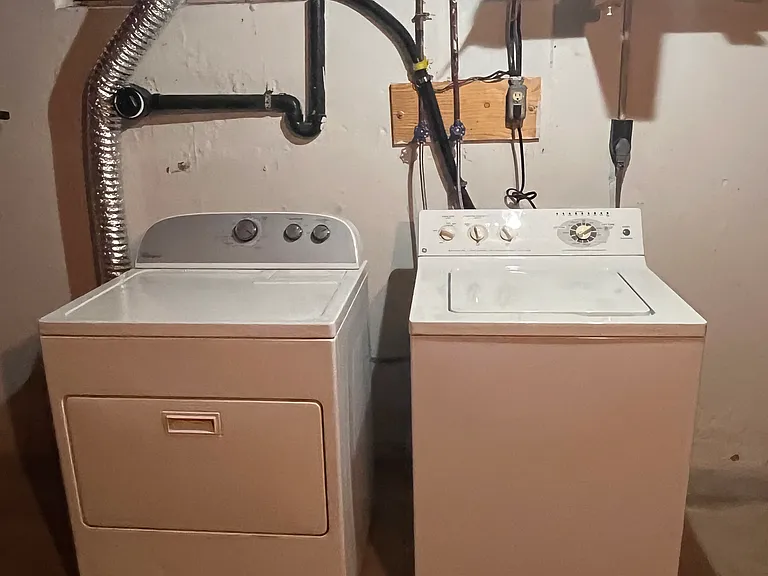 Washer and dryer in large basement