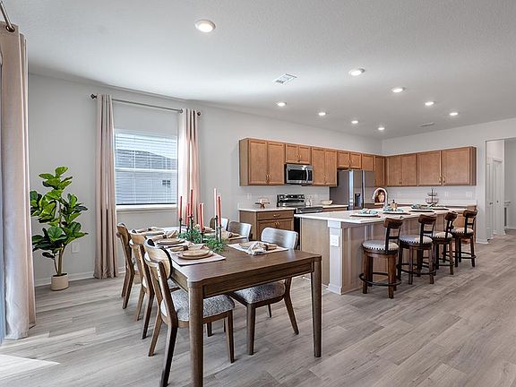 Meals are a delight in your beautiful kitchen with seating at the island and adjacent sunny dining c