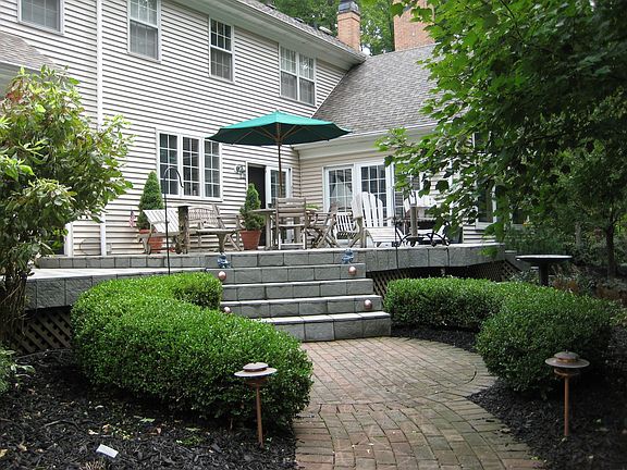 Elevated stone deck overlooking backyard