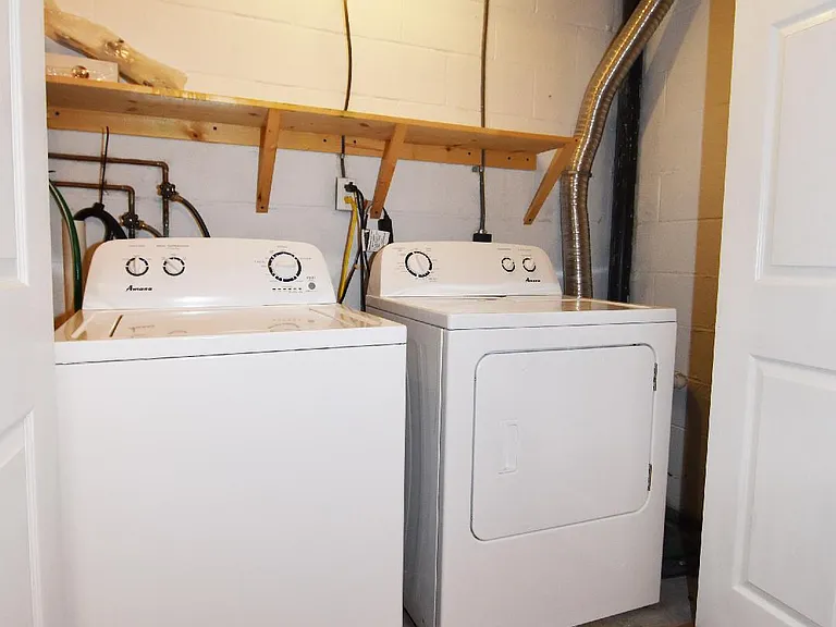 Laundry area closet in bonus room