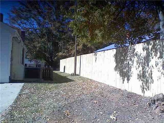 privacy fence along left side of house